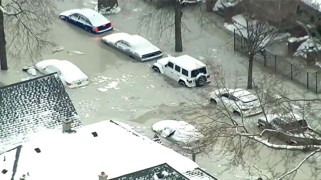 Aerial shot of cars stuck in frozen flood in a Detroit street.